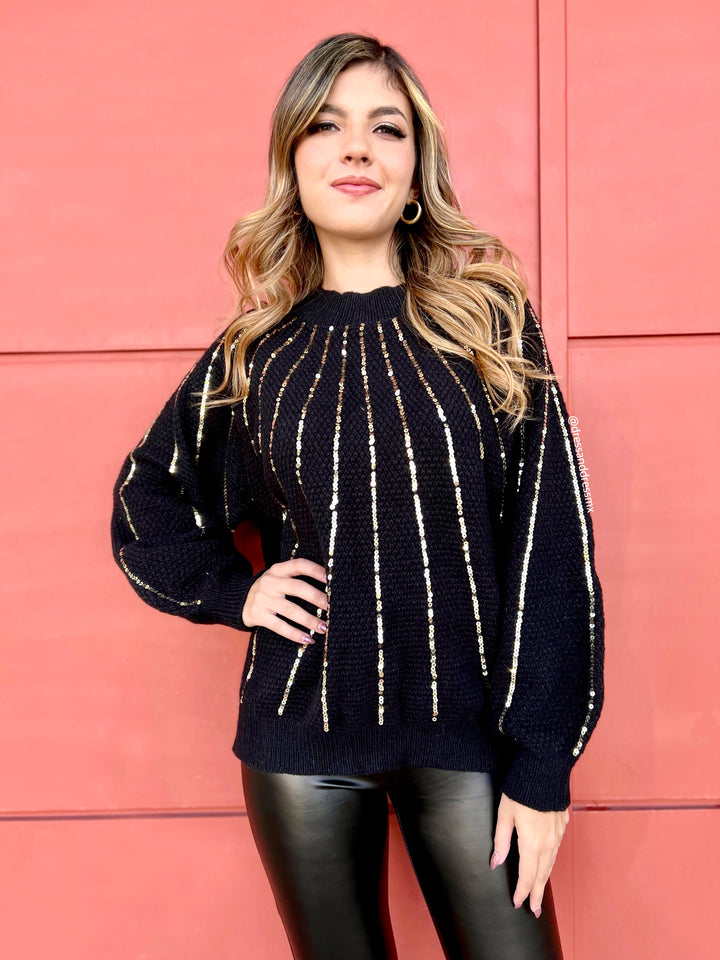 Suéter negro lentejuelas doradas
